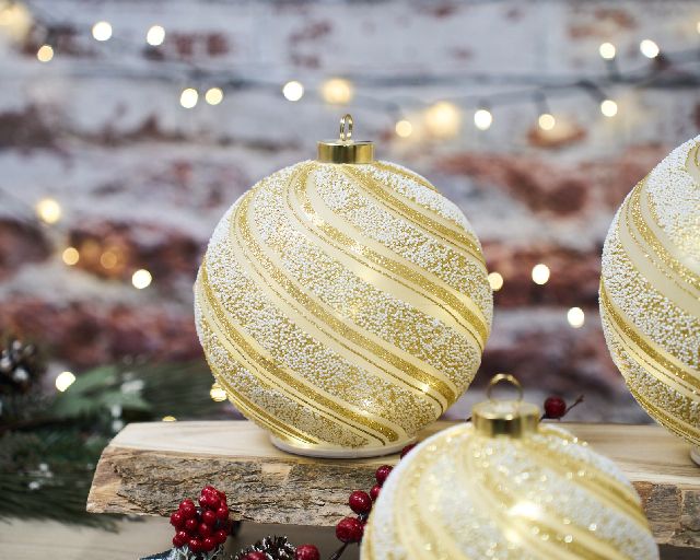 Idea regalo natale sfera girevole luminosa oro