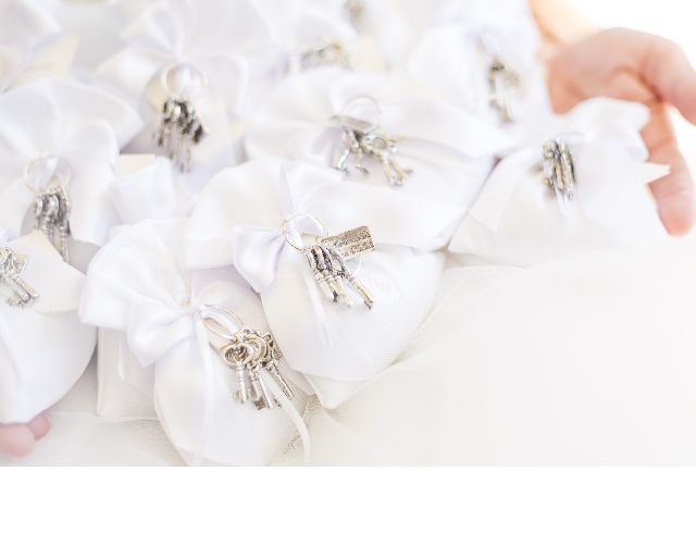 Bunch of keys silver with plate and sugared almonds
