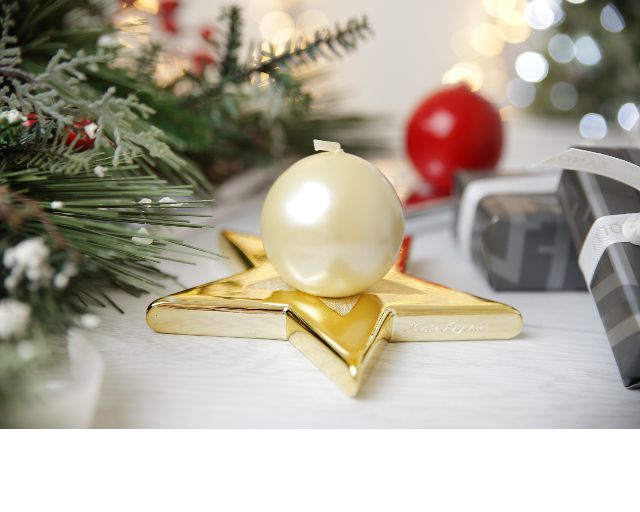 Portacandele di natale stella con candela e nastro